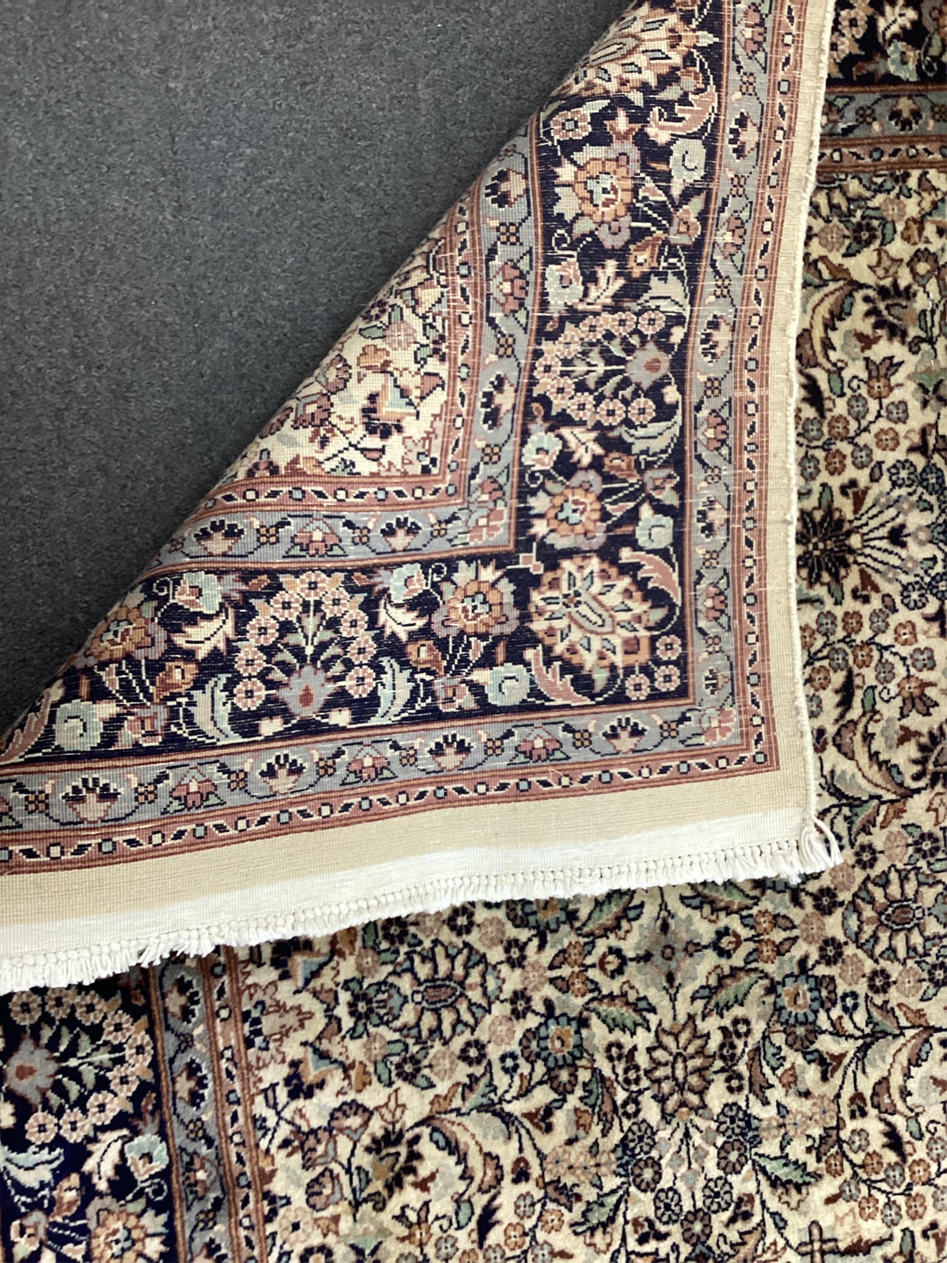 An Hereke ivory ground rug, 204 x 136cm. Condition - good